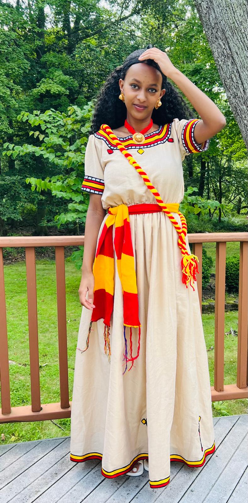Traditional Cultural Dress with Red, Yellow, and Black Accents