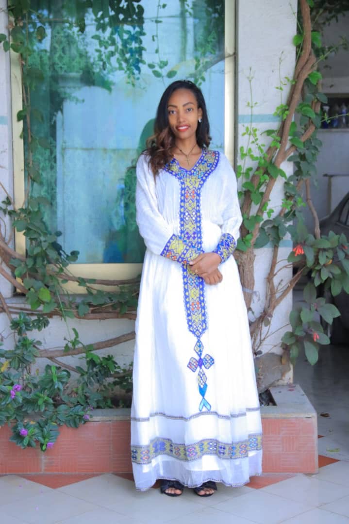 Traditional White Dress with Blue and Yellow Geometric Embroidery