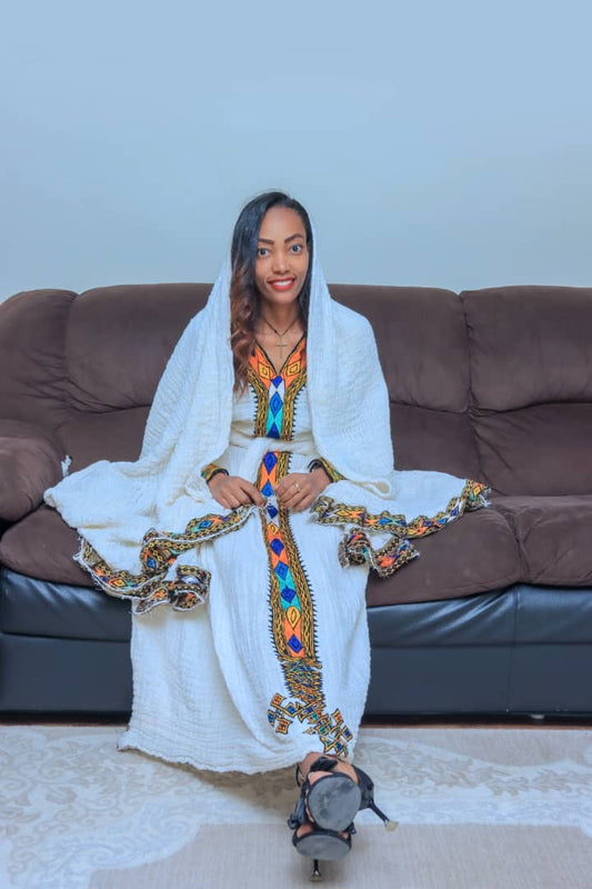 White Traditional Dress with Diamond-Patterned Orange and Blue Embroidery
