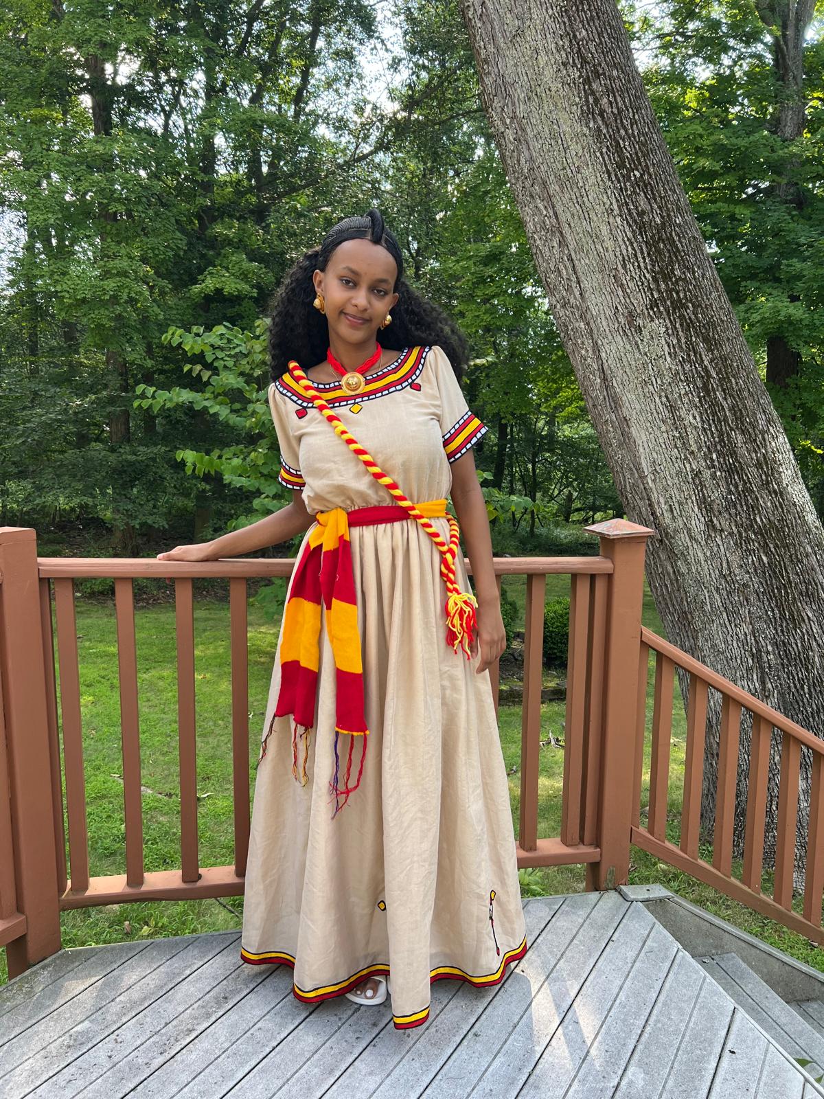 Traditional Cultural Dress with Red, Yellow, and Black Accents
