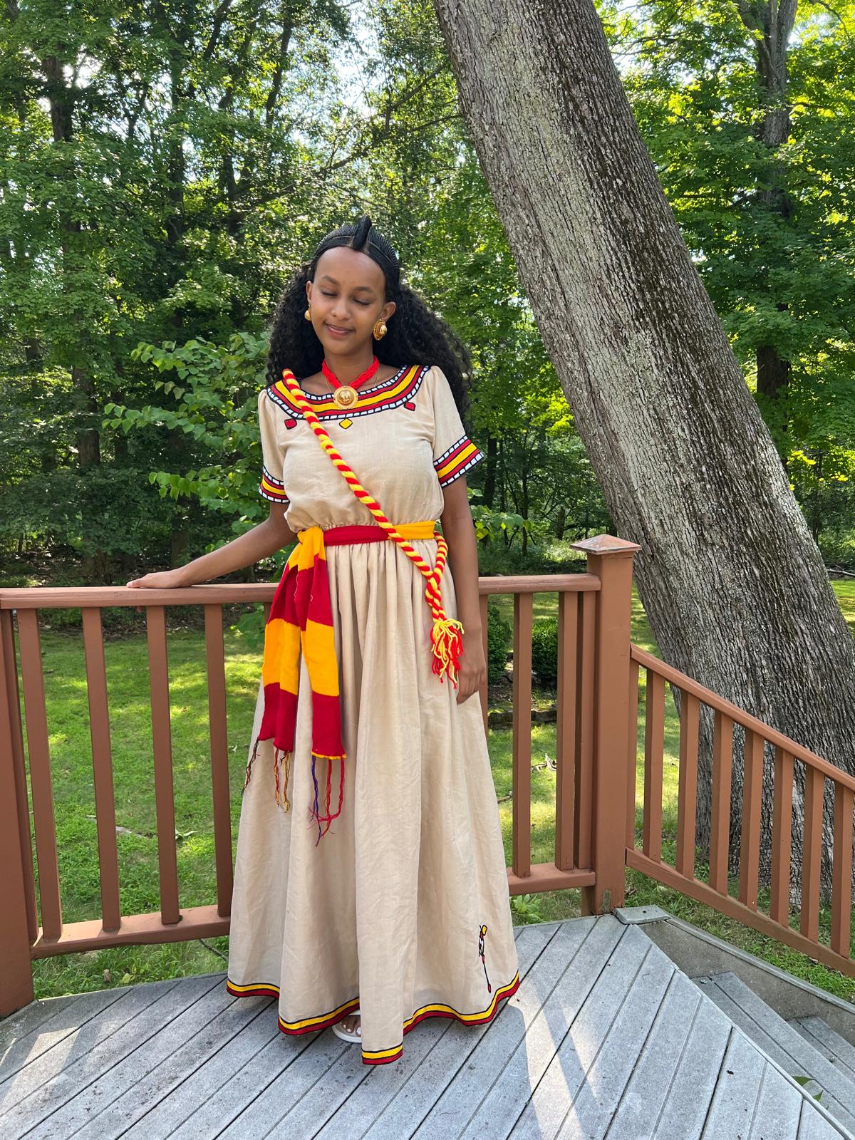 Traditional Cultural Dress with Red, Yellow, and Black Accents