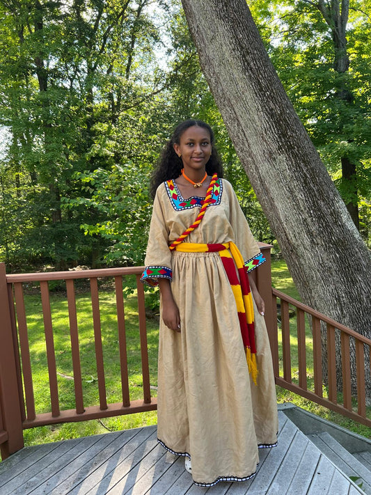 Traditional Dress in Beige with Red, Yellow, and Blue Accents