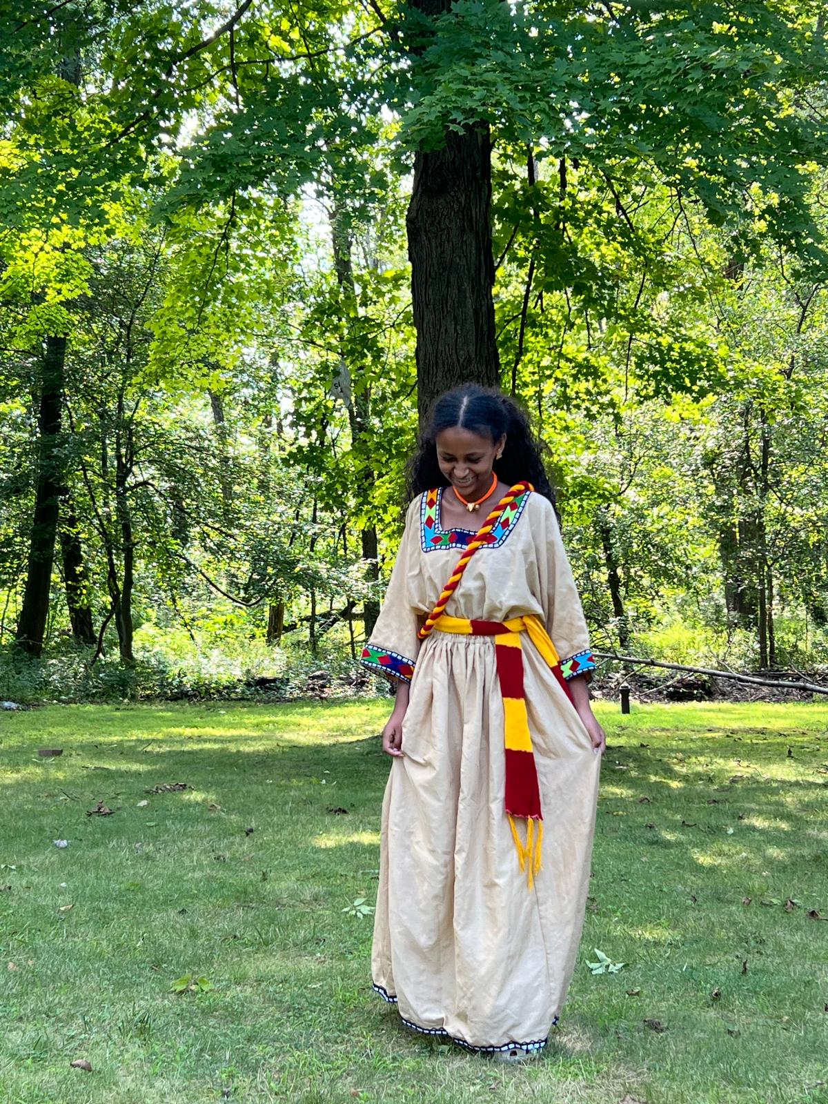 Traditional Dress in Beige with Red, Yellow, and Blue Accents
